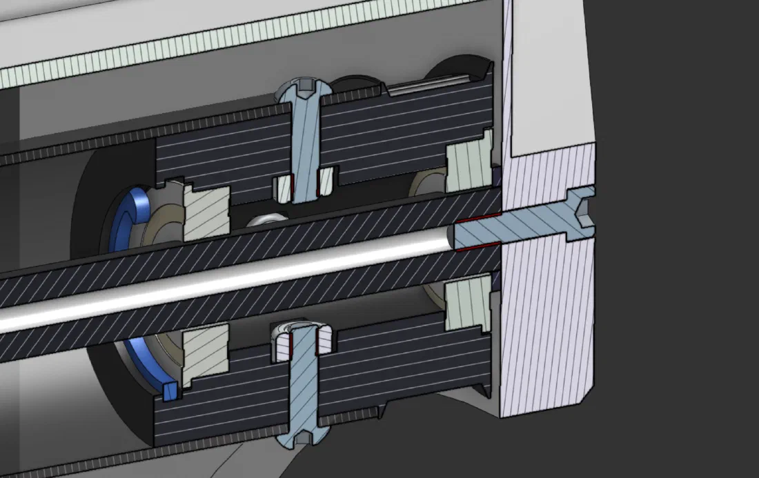 Section view of the main roller hub (left) and the printed snap ring retaining the bearing (right).