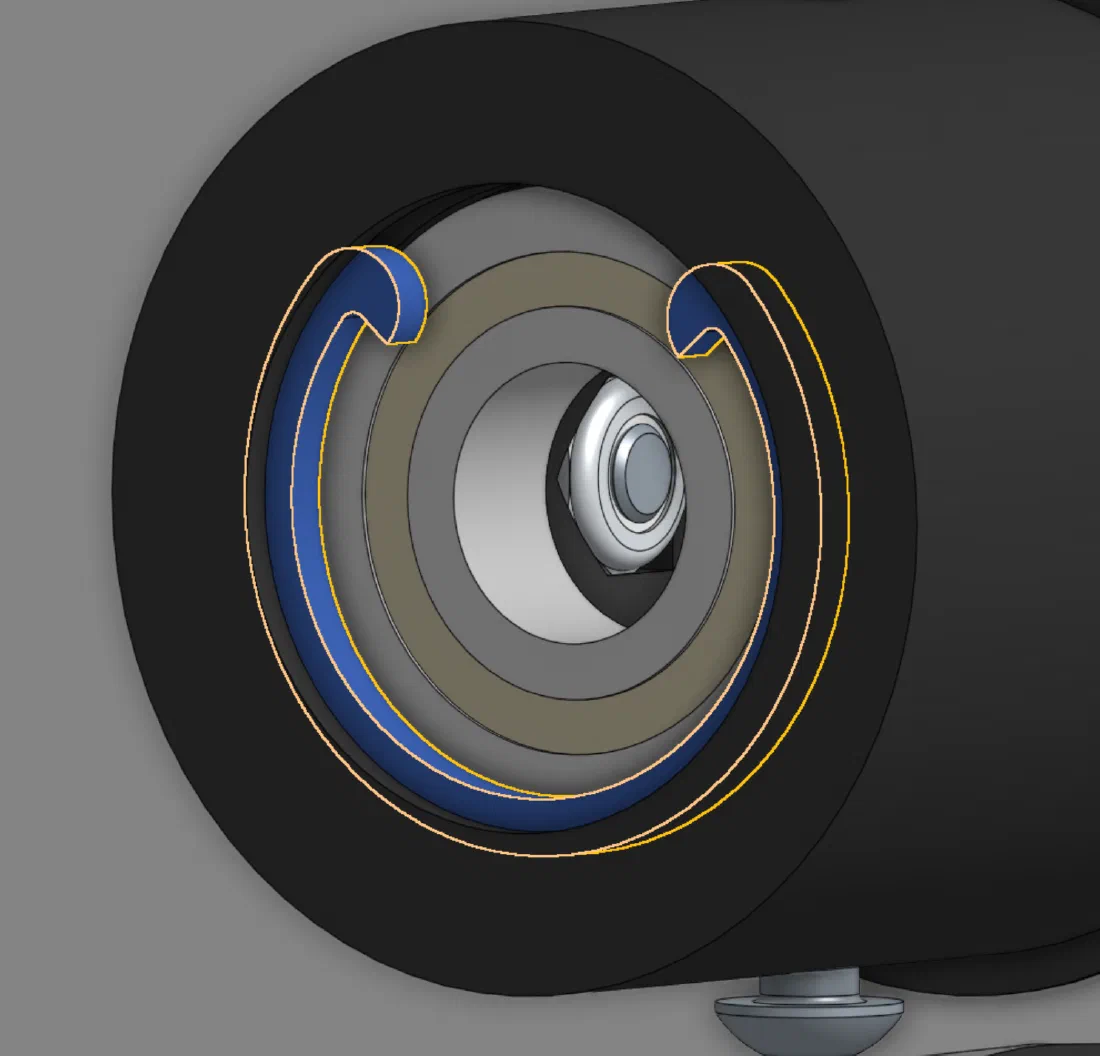 Section view of the main roller hub (left) and the printed snap ring retaining the bearing (right).